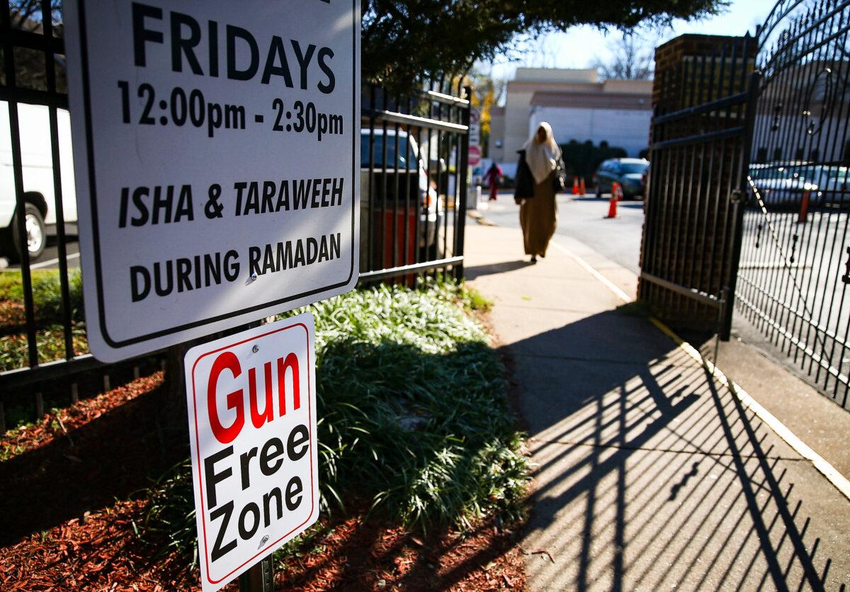 A sign reads Gun Free Zone at the entrance to the Dar Al-Hijrah Mosque in Falls Church, Va., on Dec. 4, 2015. (Mark Wilson/Getty Images)