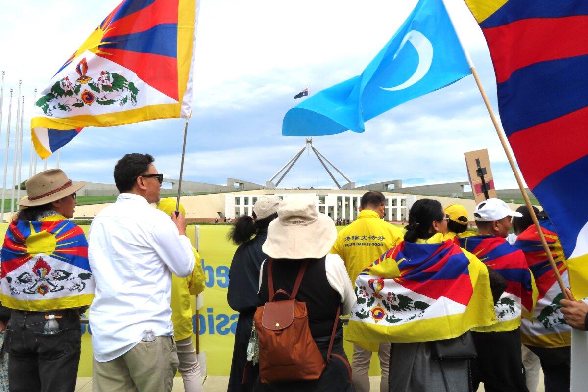 Falun Gong, Tibetan, and Uyghur communities protest CCP Foreign Minister Wang Yi's visit in Canberra, Australia, on March 20, 2024. (Rebecca Zhu/The Epoch Times)