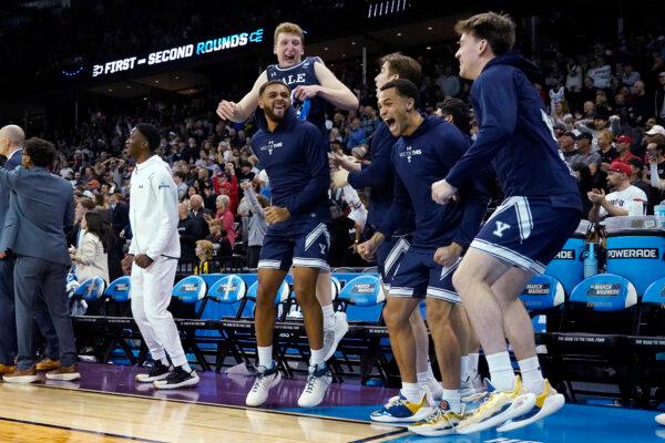 Yale bench players react during their upset of Auburn in an NCAA Tournament game in Spokane, Wash., on March 22, 2024. (Ted S. Warren/AP Photo)