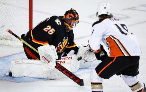 Calgary Flames goaltender Jacob Markstrom stops a shot by Anaheim Ducks winger Troy Terry during an NHL game in Calgary, Canada on April 2, 2024. (Jeff McIntosh/The Canadian Press via AP)