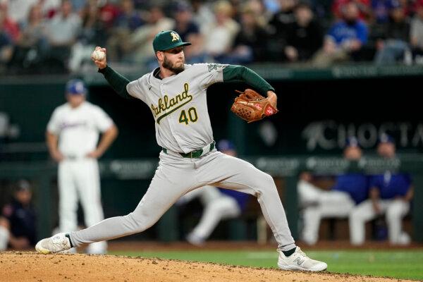 Oakland A's relief pitcher Mitch Spence throws to a Texas Rangers batter in Arlington, Texas, on April 9, 2024. (Tony Gutierrez/AP Photo)