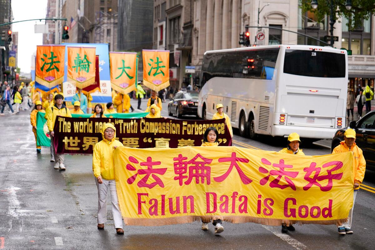 Falun Gong practitioners take part in a parade to celebrate World Falun Dafa Day while calling for an end of the persecution in China, in New York City, on May 10, 2024. (Samira Bouaou/The Epoch Times)