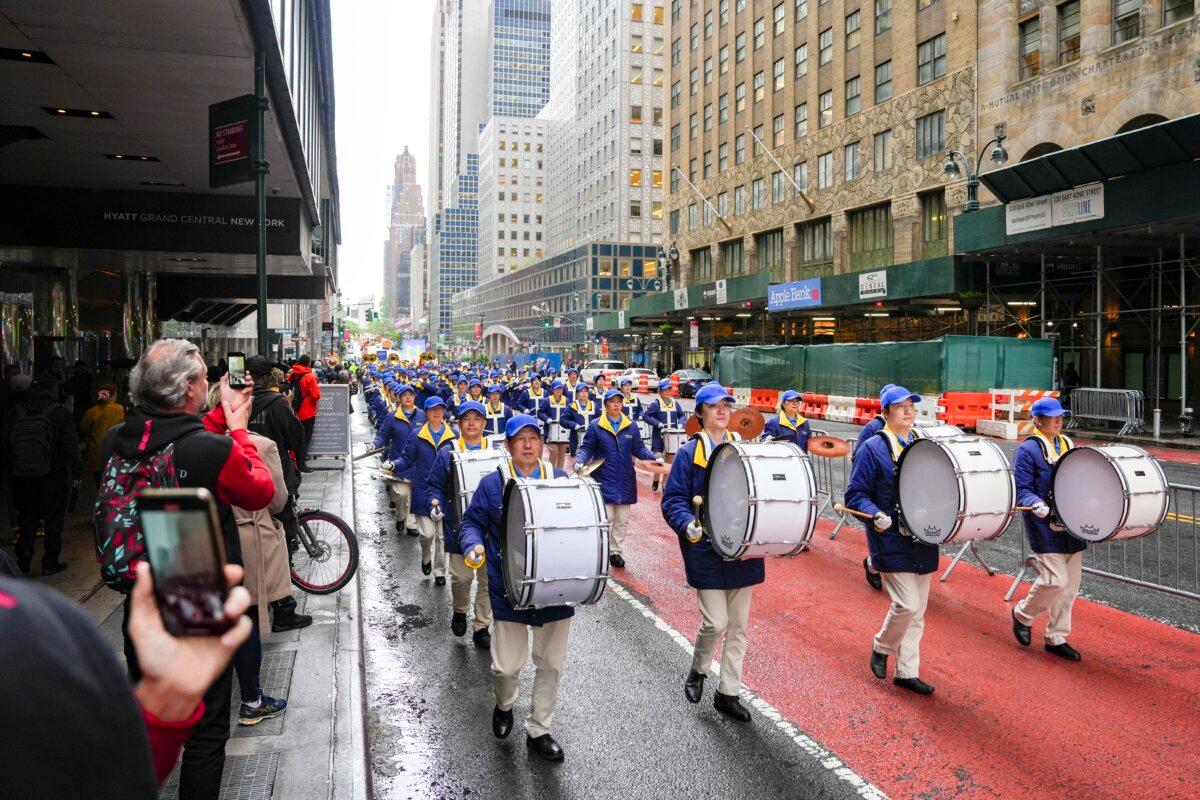 Falun Gong practitioners take part in a parade to celebrate World Falun Dafa Day while calling for an end of the persecution in China, in New York City, on May 10, 2024. (Samira Bouaou/The Epoch Times)