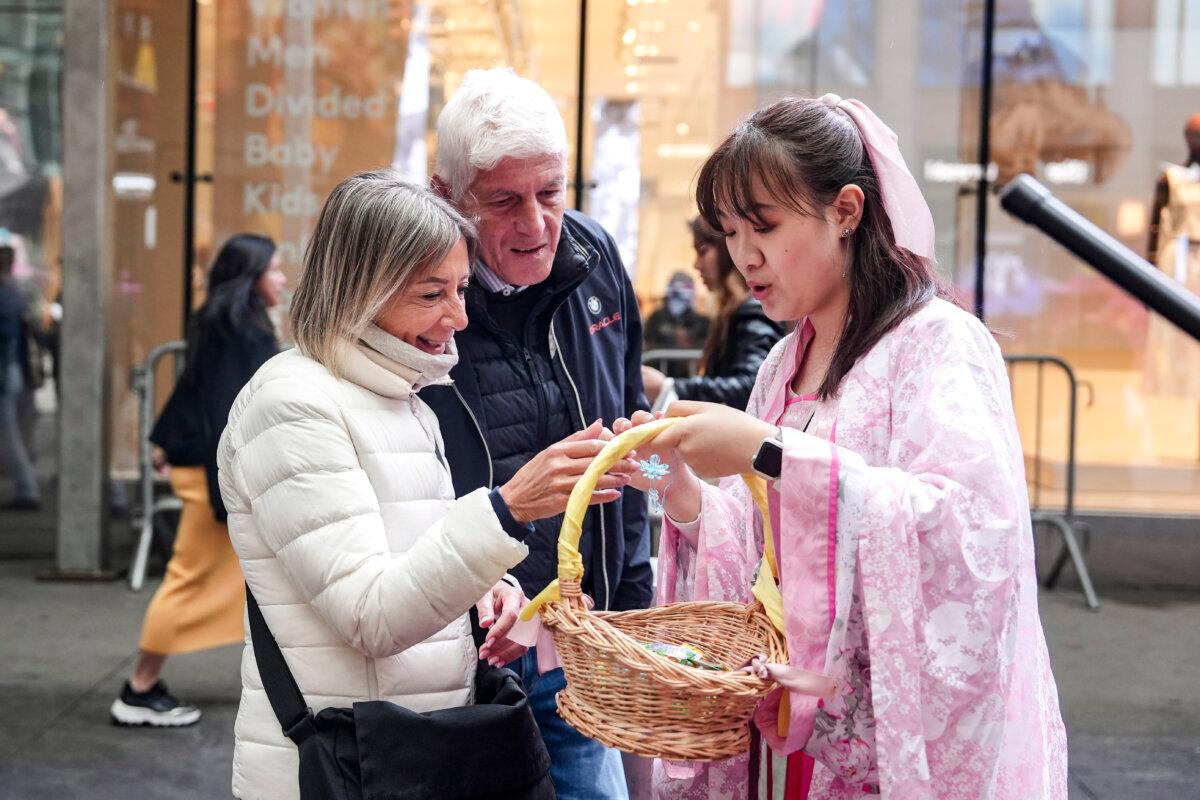 Falun Gong practitioners take part in a parade to celebrate World Falun Dafa Day while calling for an end of the persecution in China, in New York City, on May 10, 2024. (Samira Bouaou/The Epoch Times)