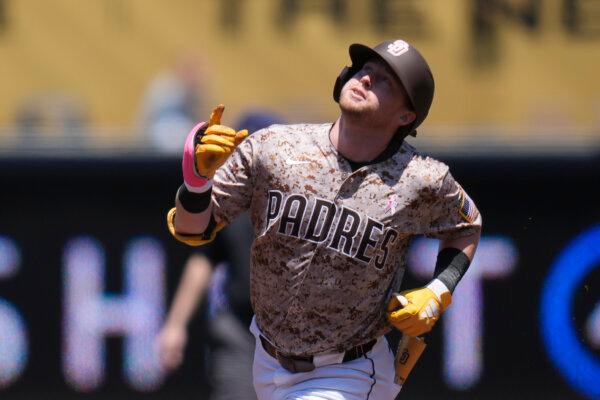 Jake Cronenworth of the Padres runs the bases after hitting a home run against the Dodgers in San Diego on May 12, 2024. (Gregory Bull/AP Photo)