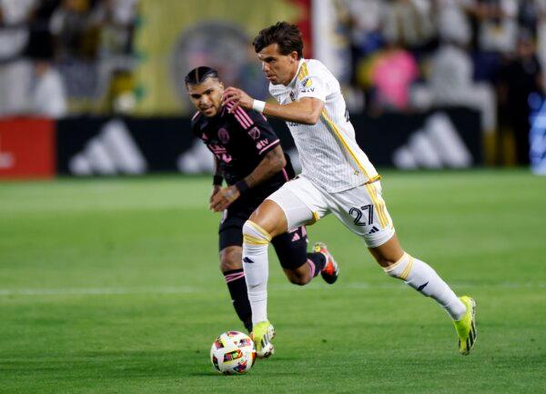 Miguel Berry (27) of the Los Angeles Galaxy is chased by DeAndre Yedlin (2) of Inter Miami during the second in Carson, Calif., on Feb. 25, 2024. (Kevork Djansezian/Getty Images)