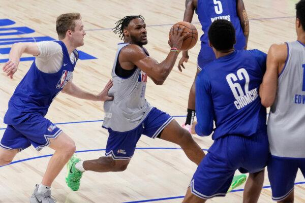 Bronny James drives to the basket during the NBA Draft Combine in Chicago on May 14, 2024. (Nam Y. Huh/AP Photo)