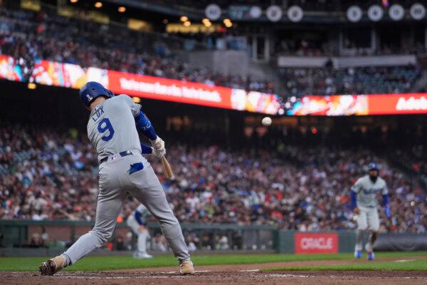 Gavin Lux of the Dodgers smacks an RBI triple against the Giants in San Francisco on May 14, 2024. (Godofredo A. Vásquez/AP Photo)