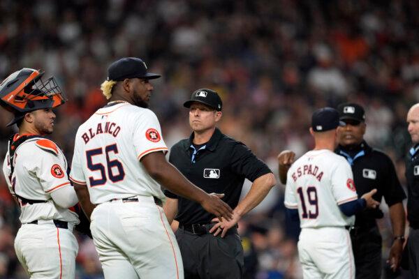 Astros pitcher Ronel Blanco talks with second-base umpire Tripp Gibson after being ejected from a game against the A's following a foreign-substance check in Houston on May 14, 2024. (David J. Phillip/AP Photo)