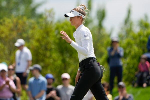 Nelly Korda holds up her ball after sinking a putt on the fourth hole during the final round of the Mizuho Americas Open in Jersey City, N.J., on May 19, 2024. (Seth Wenig/AP Photo)