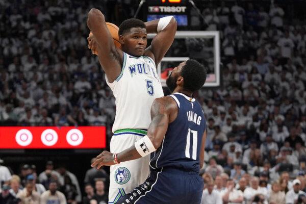 Kyrie Irving (R) of the Mavericks defends against Timberwolves guard Anthony Edwards during Game 1 of the NBA Western Conference finals in Minneapolis on May 22, 2024. (Abbie Parr/AP Photo)