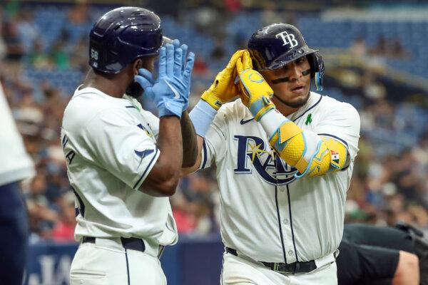 Isaac Paredes (R) and Rays teammate Randy Arozarena react after Paredes hit a home run against the A's in St. Petersburg, Fla., on May 30, 2024. (Mike Carlson/AP Photo)