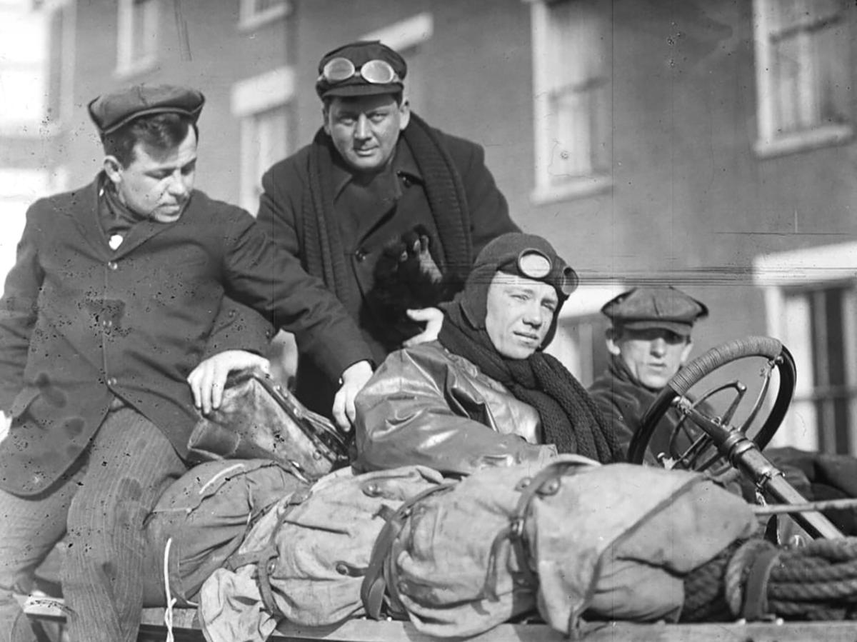 (L–R) Montague Roberts, George Schuster, George Miller, and New York Times reporter T. Walter Williams sitting in the Thomas Flyer. Gift of the Family of Henry Austin Clark, Jr., The Henry Ford, Dearborn, MI. (The Henry Ford Museum)