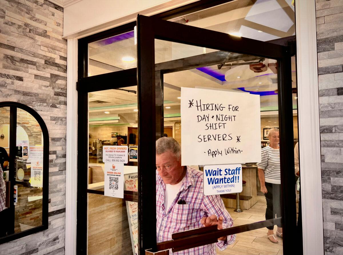 Hiring announcement on a door at a restaurant in Vineland, N.J., on June 4, 2024. (Madalina Vasiliu/The Epoch Times)
