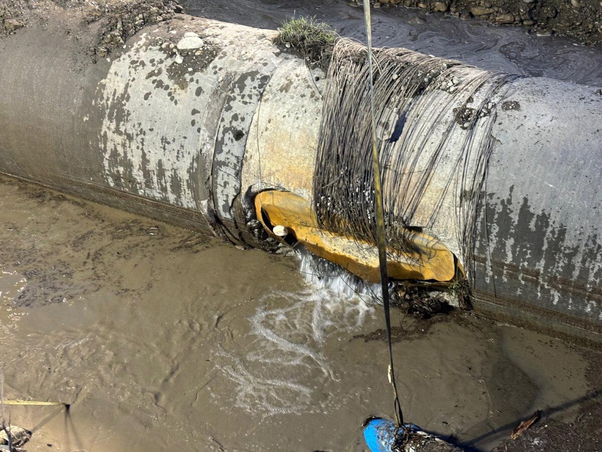 The damaged section of a water pipe is shown in this handout image provided by the City of Calgary in June 2024. (The Canadian Press/HO-City of Calgary)