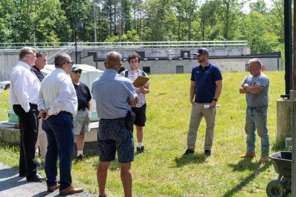 Village of Bloomingburg Mayor Russell Wood (R) during a tour of the sewer plant with government officials and concerned citizens in Bloomingburg, N.Y., on June 27, 2024. (Cara Ding/The Epoch Times)