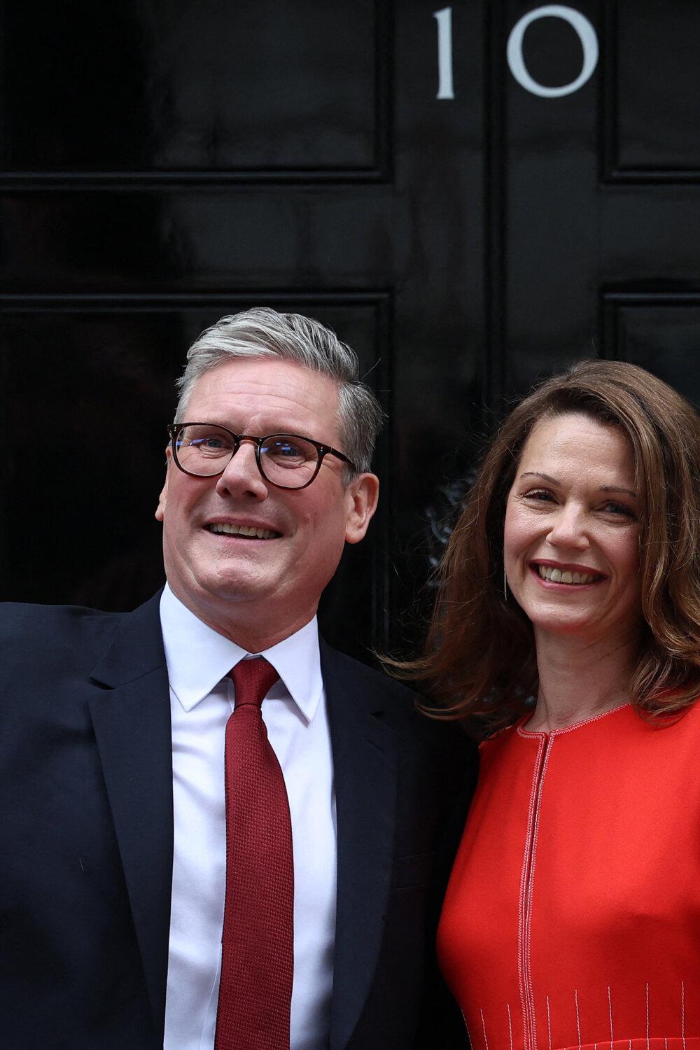Britain's incoming Prime Minister Sir Keir Starmer and his wife Victoria wave as they pose on the steps of 10 Downing Street in London on July 5, 2024. (Justin Tallis/AFP via Getty Images)