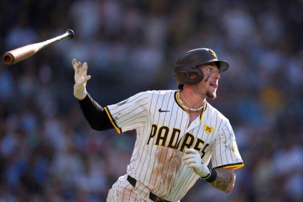 Padres rookie Jackson Merrill tosses his bat as he watches his three-run home run against the Milwaukee Brewers in San Diego on June 22, 2024. (Gregory Bull/AP Photo)