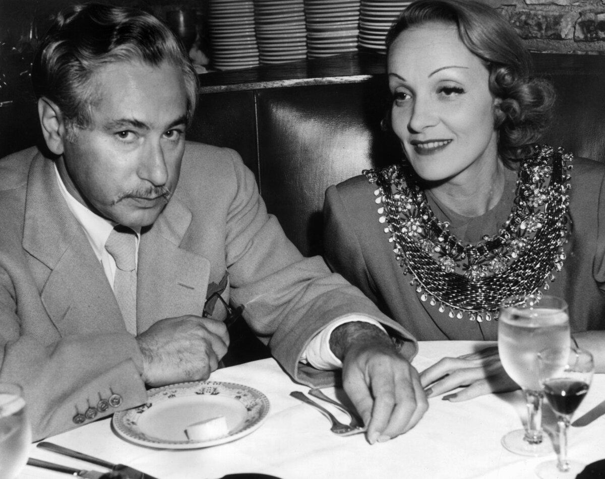 Actress Marlene Dietrich sits with film director Josef von Sternberg in a booth at Cafe La Maze, circa 1935. (Hulton Archive/Getty Images)