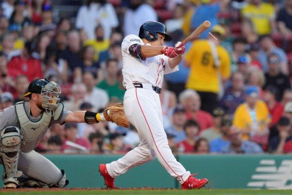 Masataka Yoshida of the Red Sox connects for a two-run single against the A's in Boston on July 11, 2024. (Steven Senne/AP Photo)