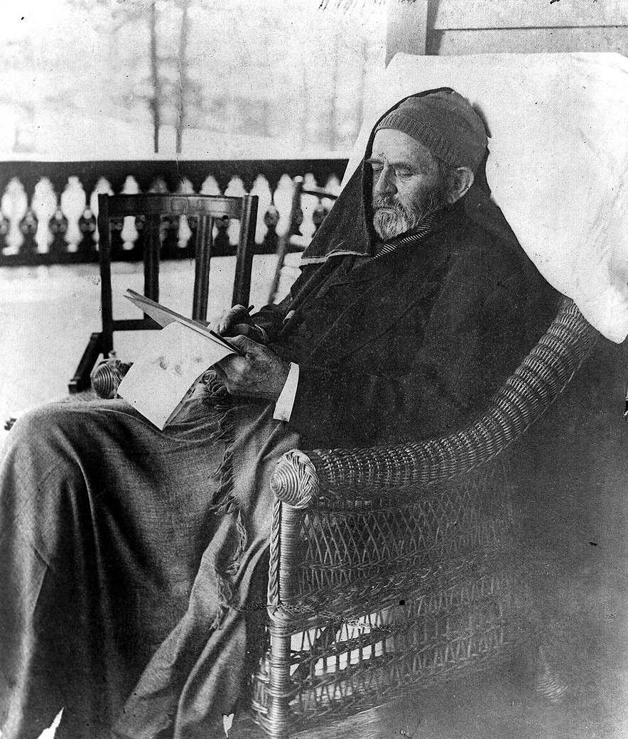 Grant working on his memoirs, less than a month before his death. (Public Domain)