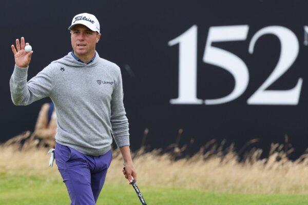 Justin Thomas reacts after putting out on the 18th green during the opening round of the British Open in Troon, Scotland, on July 18, 2024. (Scott Heppell/AP Photo)