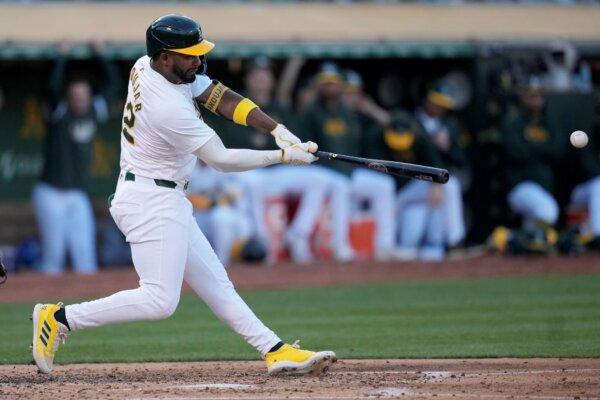 The A's Miguel Andujar smashes a two-run double against the Astros in Oakland, Calif., on July 22, 2024. (Jeff Chiu/AP Photo)