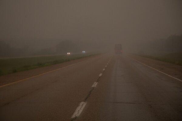 Smoke hangs over Highway 16 westbound to Jasper outside of Edmonton, on July 25, 2024. (The Canadian Press/Amber Bracken)