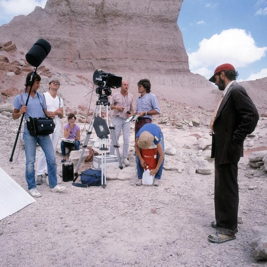 Director Wim Wenders (2nd L) with Harry Dean Stanton (R) on the set of "Paris, Texas." (Road Movies) <span style="color: #ff0000;"> </span>