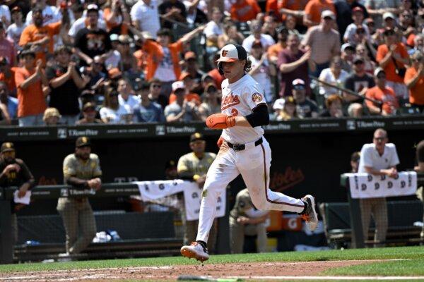 The Orioles' Gunnar Henderson scores on a Ryan Mountcastle single against the Padres in Baltimore on July 28, 2024. (Terrance Williams/AP Photo)