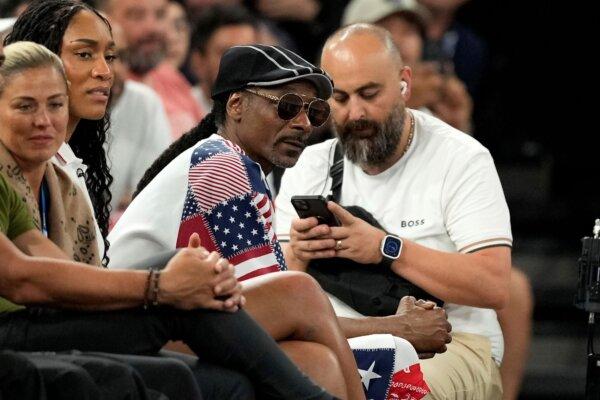 Snoop Dogg watches a men's basketball game between the United States and Brazil at the Olympics in Paris on Aug. 6, 2024. (Michael Conroy/AP Photo)