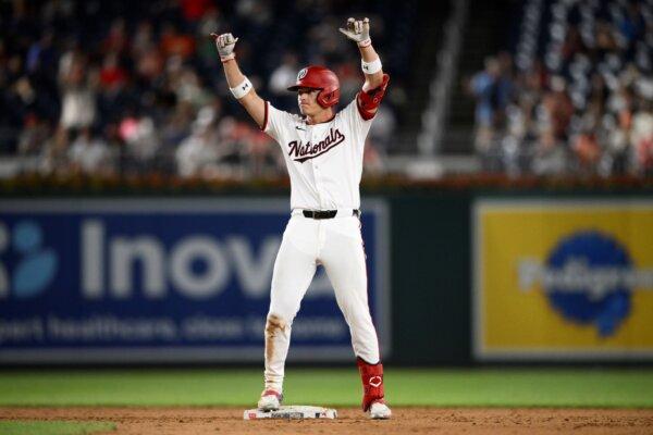 The Nationals' Alex Call gestures as he stands on second base with a double against the Giants in Washington on Aug. 6, 2024. (Nick Wass/AP Photo)