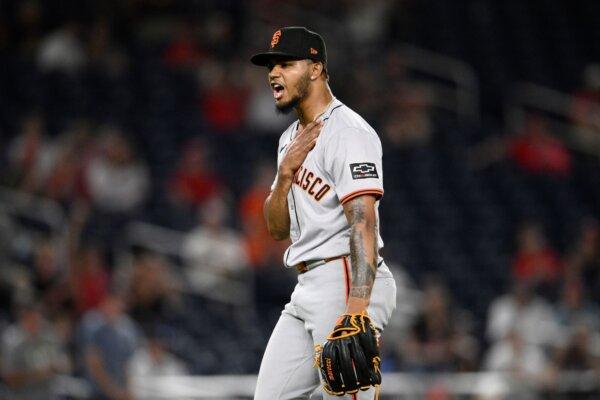 Giants closer Camilo Doval reacts after finishing off a victory over the Nationals in Washington on Aug. 7, 2024. (Nick Wass/AP Photo)