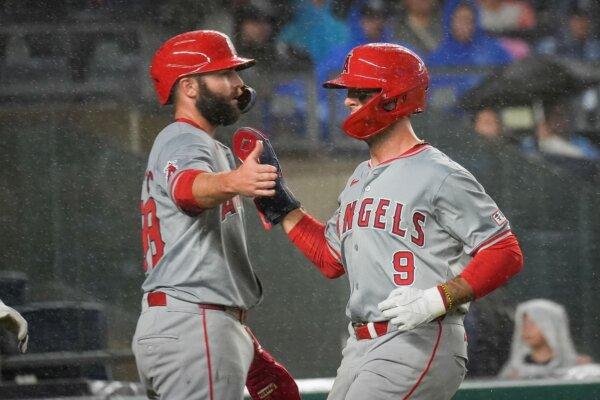 Angels teammates Michael Stefanic (L) and Zach Neto celebrate after both scored during the fifth inning against the Yankees in New York on Aug. 8, 2024. (Bryan Woolston/AP Photo)