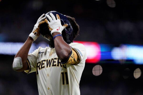 Brewers rookie Jackson Chourio yells into his helmet in frustration after grounding out against the Dodgers in Milwaukee on Aug. 12, 2024, (Aaron Gash/AP Photo)