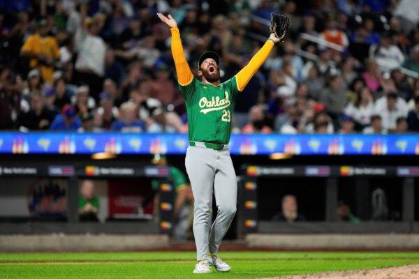 A's reliever Austin Adams reacts after escaping a big jam against the Mets in New York on Aug. 13, 2024. (Julia Nikhinson/AP Photo)