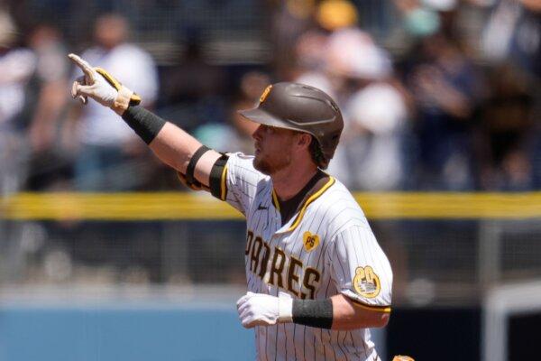 The Padres' Jake Cronenworth exults after hitting a three-run, first-inning home run against the Pirates in San Diego on Aug. 14, 2024. (Gregory Bull/AP Photo)