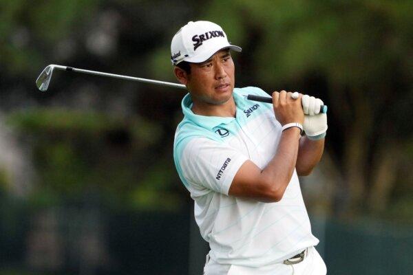 Hideki Matsuyama watches his shot from the 17th fairway during the first round of the St. Jude Championship in Memphis, Tenn., on Aug. 15, 2024. (Mark Humphrey/AP Photo)