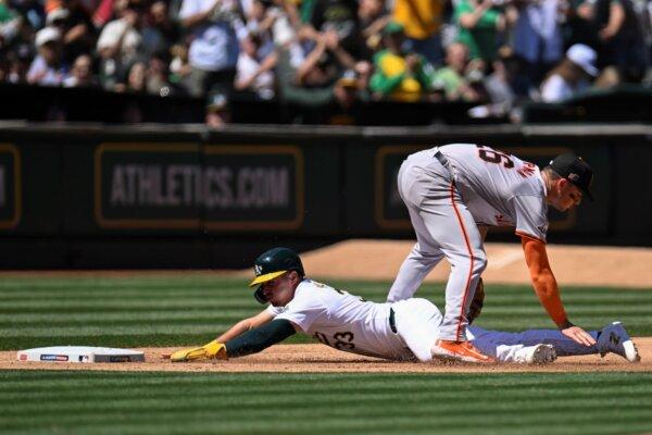 Giants third baseman Matt Chapman tags out A's baserunner JJ Bleday to end the sixth inning in Oakland, Calif., on Aug. 18, 2024. (Eakin Howard/AP Photo)