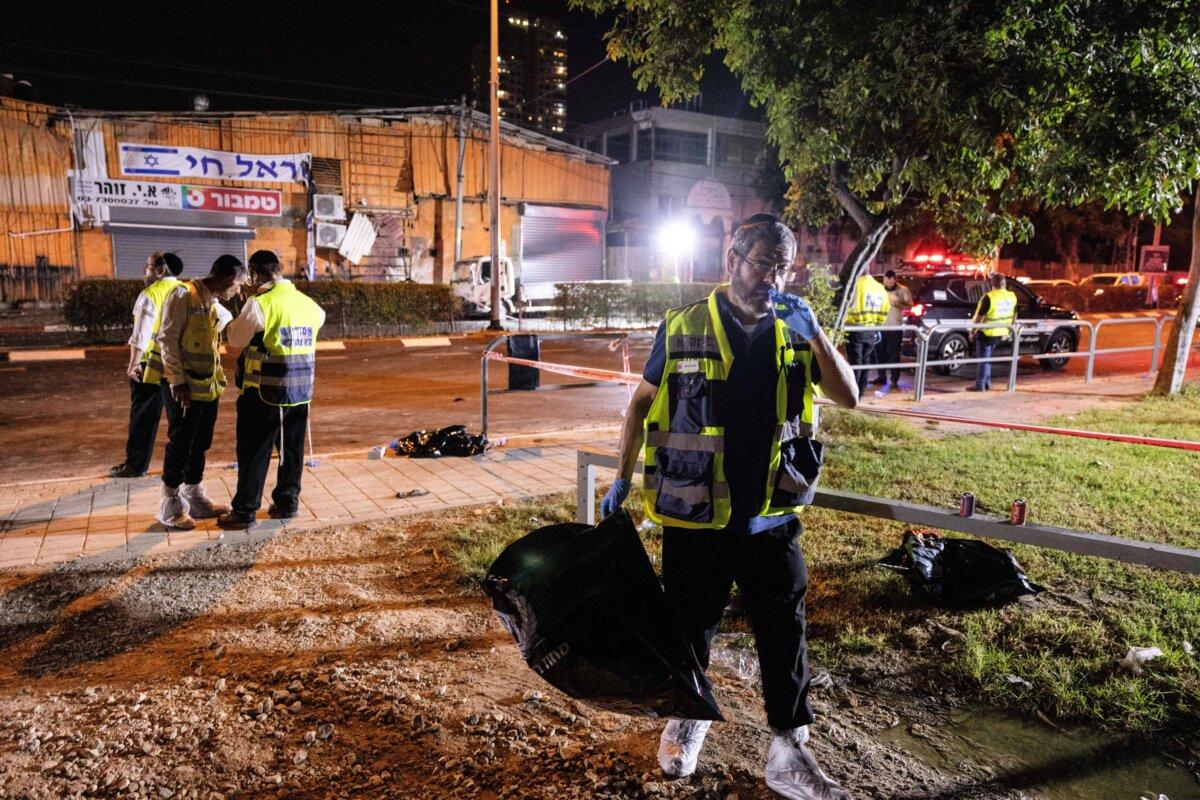 Israeli security and emergency responders work at the site of a bomb blast in Tel Aviv, Israel, on Aug. 18, 2024. (Moti Milrod/Reuters)