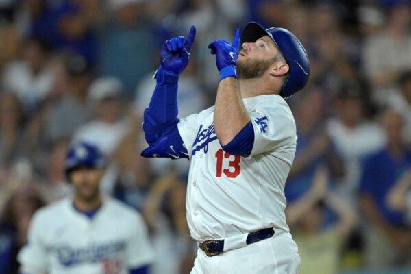 The Dodgers' Max Muncy crosses the plate after hitting a home run against the Mariners in Los Angeles on Aug. 20, 2024. (Jayne-Kamin-Oncea/AP Photo)