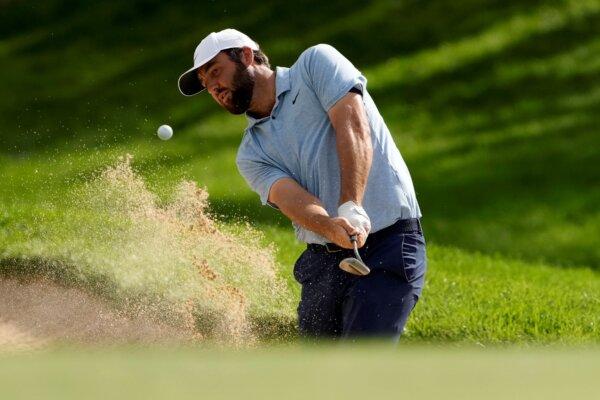 Scottie Scheffler hits from the bunker on the first hole during the opening round of the BMW Championship in Castle Rock, Colo., on Aug. 22, 2024. (Matt York/AP Photo)