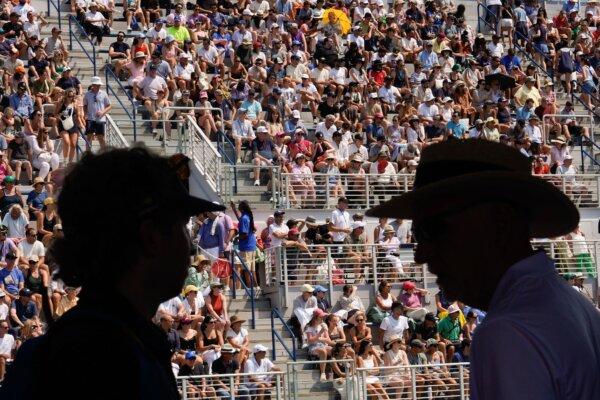 Spectators move in and out of their seats during the first round of the U.S. Open in New York on Aug. 26, 2024. (Julia Nikhinson/AP Photo)