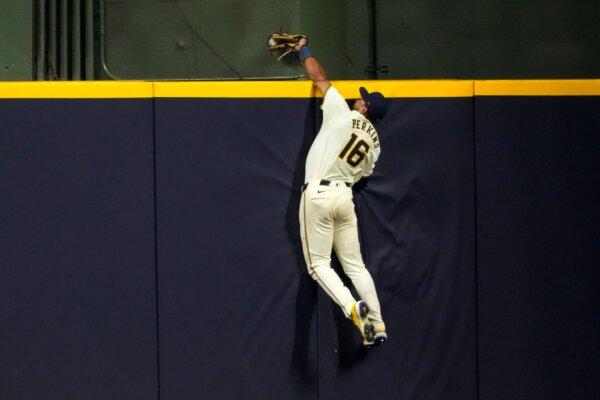 Brewers center fielder Blake Perkins robs the Giants' Thairo Estrada of a home run in Milwaukee on Aug. 27, 2024. (Morry Gash/AP Photo)