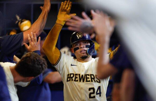 William Contreras is the man of the hour in the Brewers' dugout after capping a five-run fifth inning with a two-run home run against the Giants in Milwaukee on Aug. 28, 2024. (Jeffrey Phelps/AP Photo)