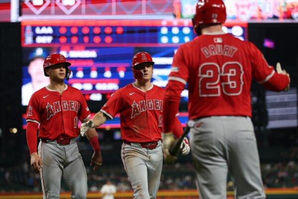 Mickey Moniak (16) of the Los Angeles Angels celebrates his two run sixth inning home run with Logan O'Hoppe (14) and Brandon Drury (23) while playing the Detroit Tigers in Detroit on Aug. 28, 2024. (Gregory Shamus/Getty Images)
