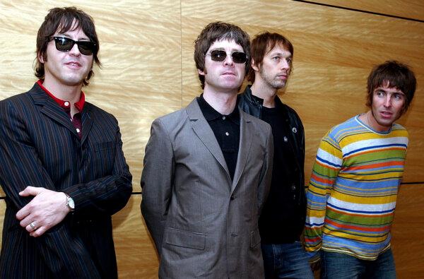 Members of British rock band Oasis pose for photos ahead of a concert, in Hong Kong, on Feb. 25, 2006. (Lo Sai Hung/AP Photo)