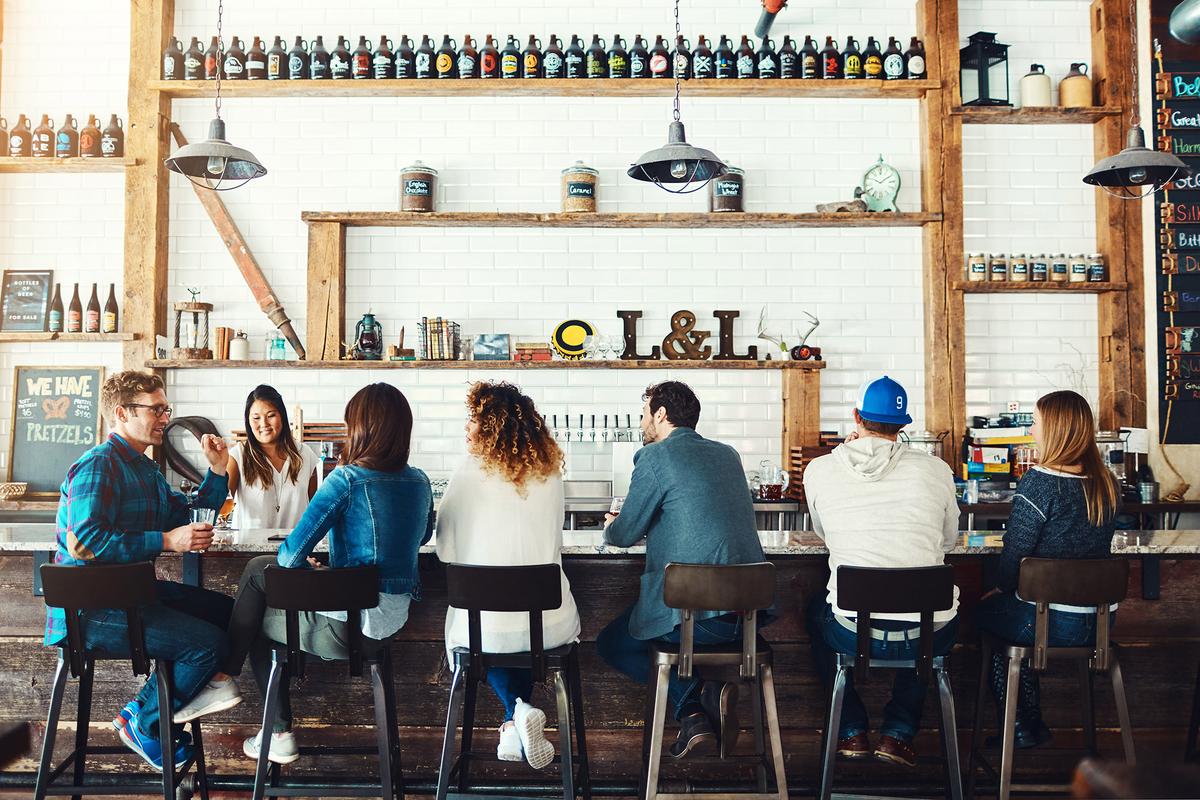Sitting at the bar can elicit engaging conversations and helpful information from locals. (gradyreese/iStock/Getty Images)
