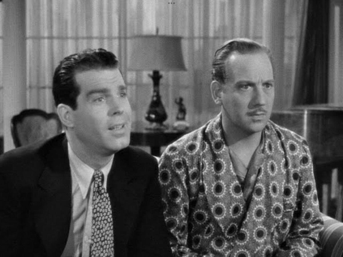 Bill Cardew (Fred MacMurray, L) and Henry Lowndes (Melvyn Douglas) are husband to the same lady, in “Too Many Husbands.” (Columbia Pictures)