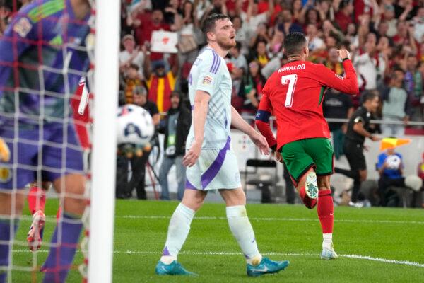 Portugal's Cristiano Ronaldo, (R), celebrates after scoring his side's second goal during the UEFA Nations League soccer match between Portugal and Scotland at the Luz stadium in Lisbon, Portugal, on Sept. 8, 2024. (Armando Franca/AP Photo)